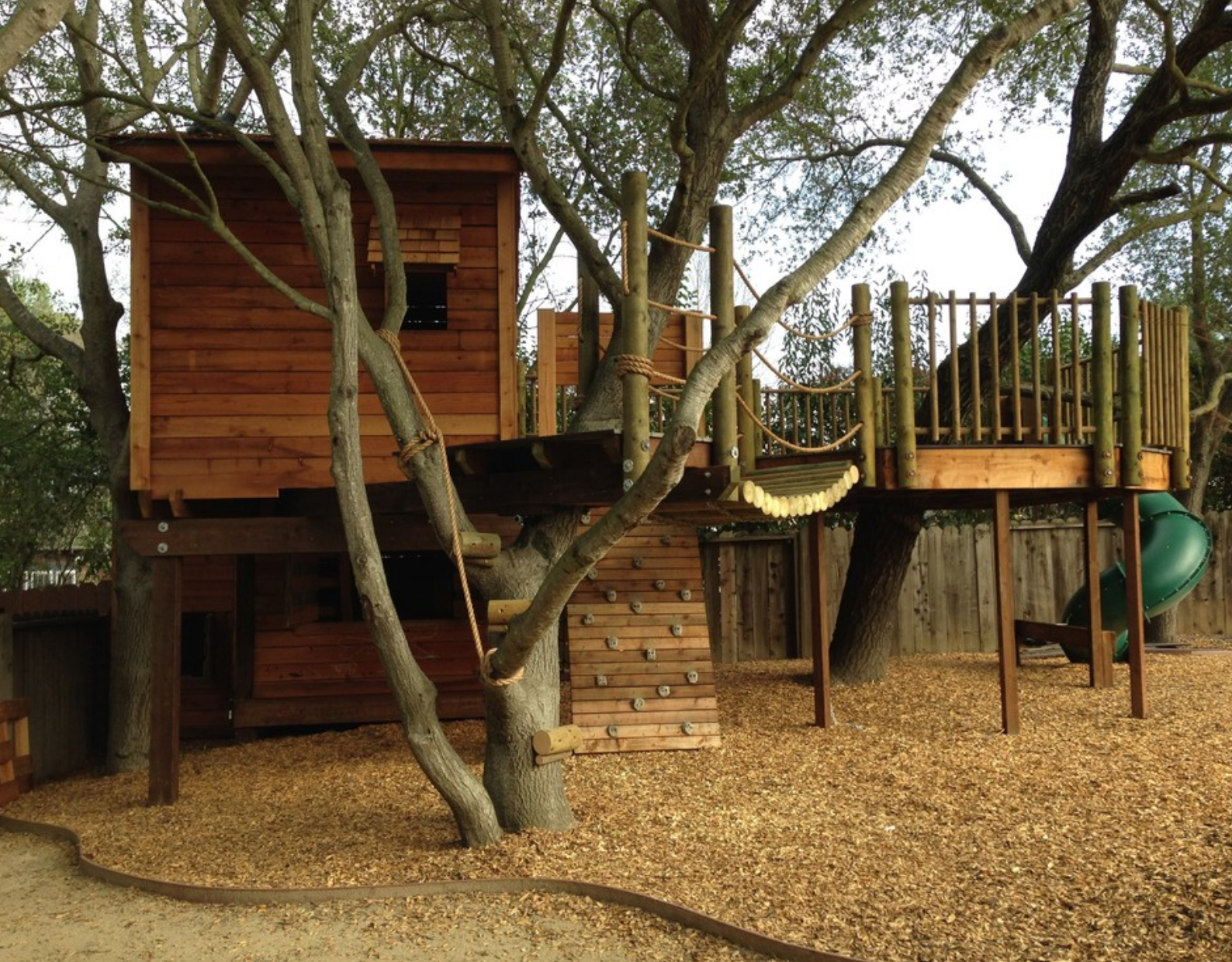 Two-story Tree-house With Slide And Rock Wall