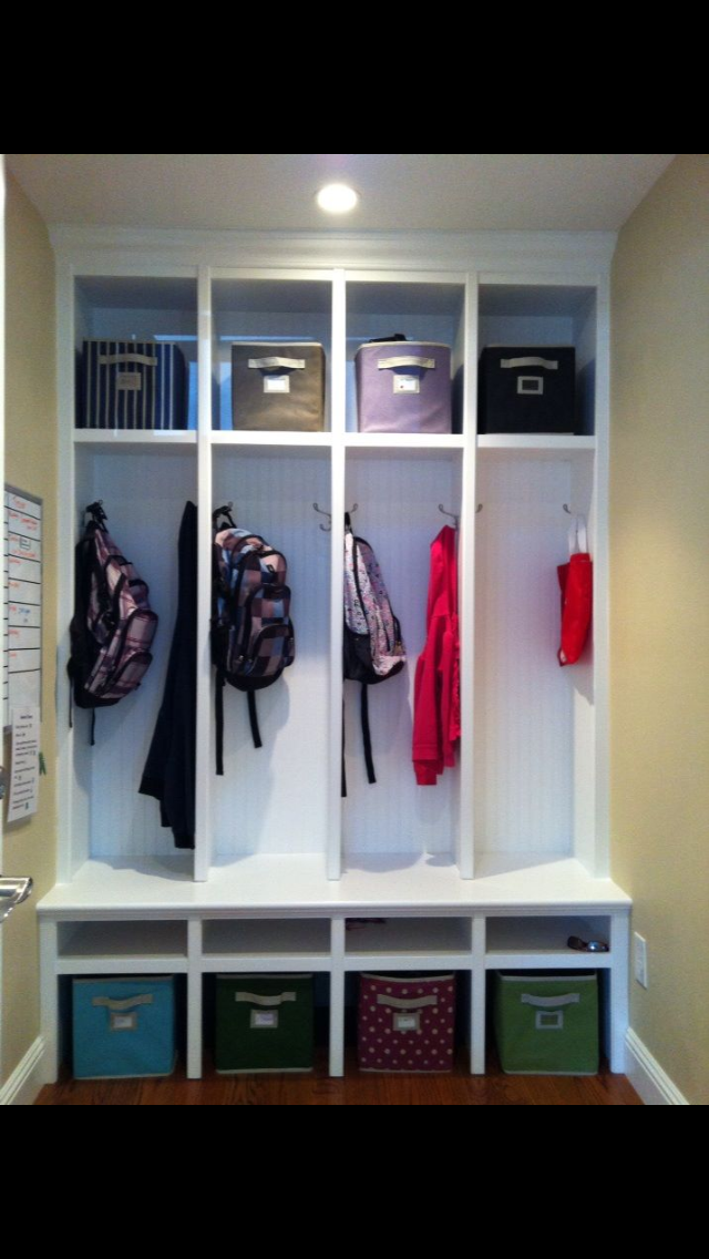 Custom Mudroom Bench With Individual Storage Areas And Hooks