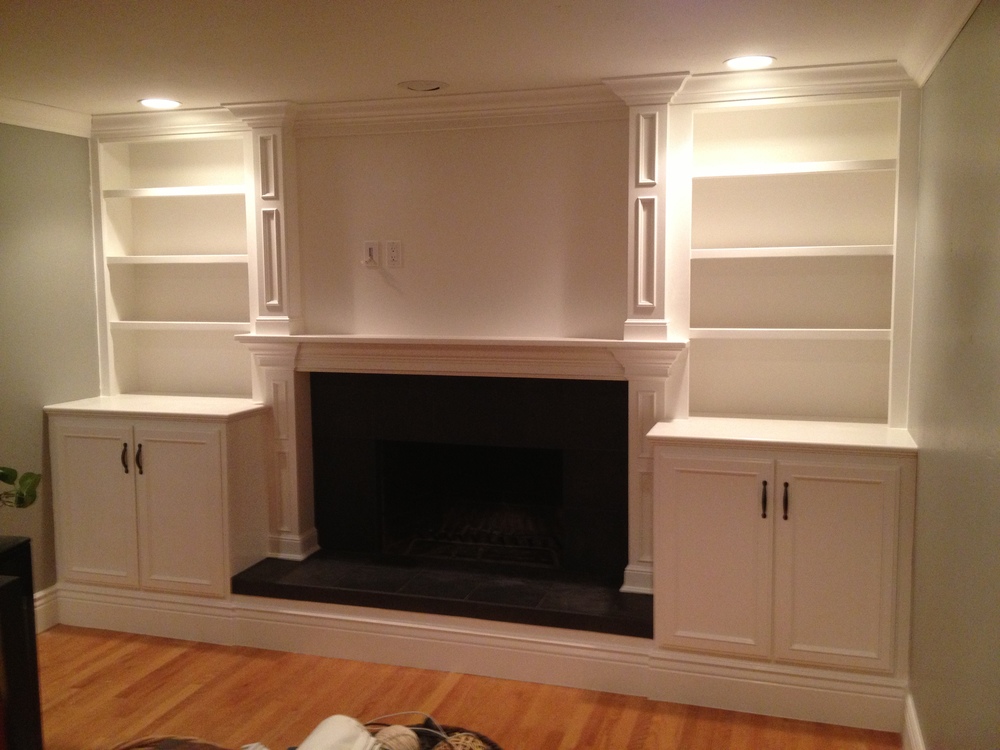Custom TV Wall Unit with open shelving and Mantel