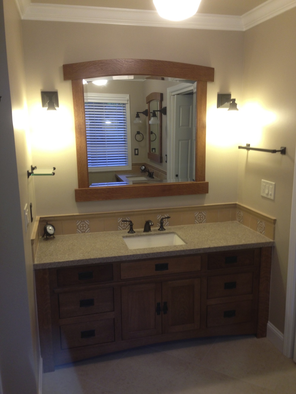 1970’s bathroom gets a complete makeover with fully custom cabinets and matching mirrors
