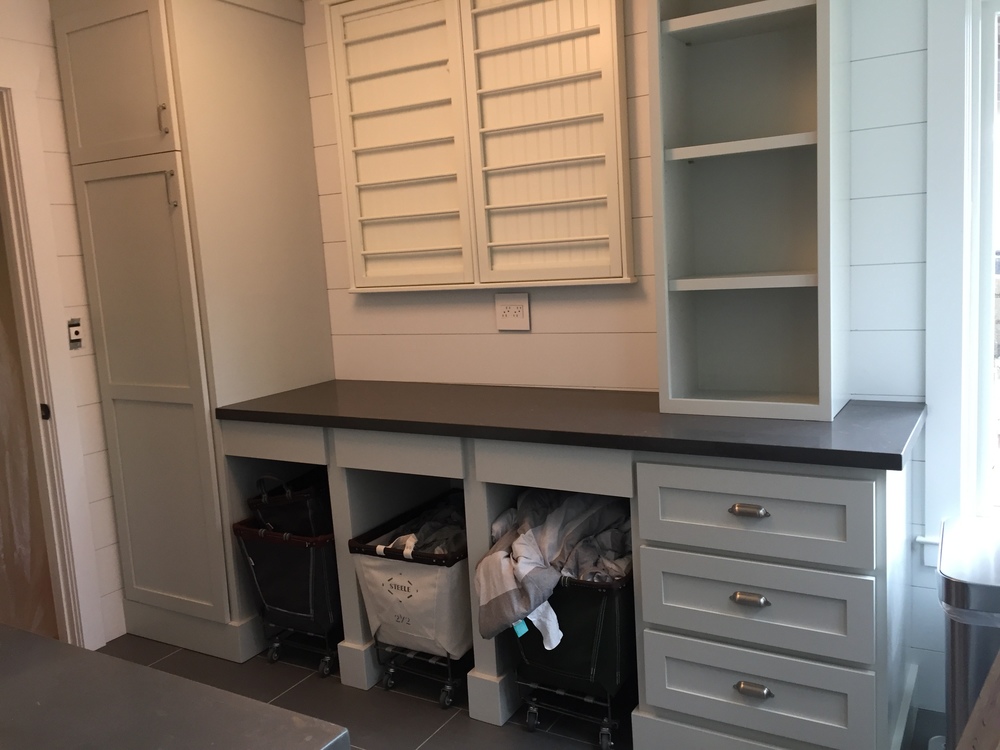 Custom Laundry Room Cabinets With Storage Space And Finish Trim